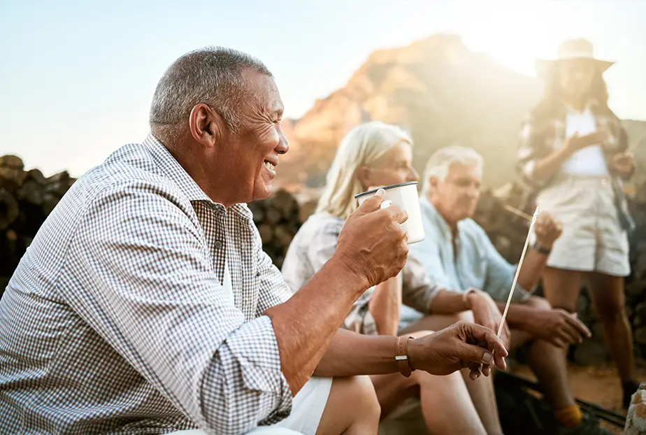 senior friends having coffee together while camping how to plan for retirement